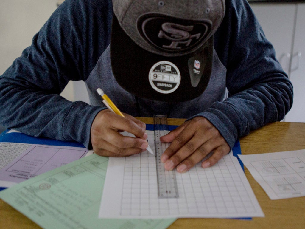 A student practices graphing in Algebra I at Rudsdale Newcomer High School in Oakland. Anne Wernikoff for EdSource